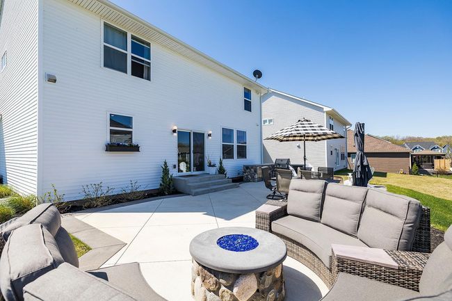 Professionally landscaped with over 50 different varieties of perennial plantings chosen to have blooms during the entire growing season, along with pollinator garden off the patio! | Image 41