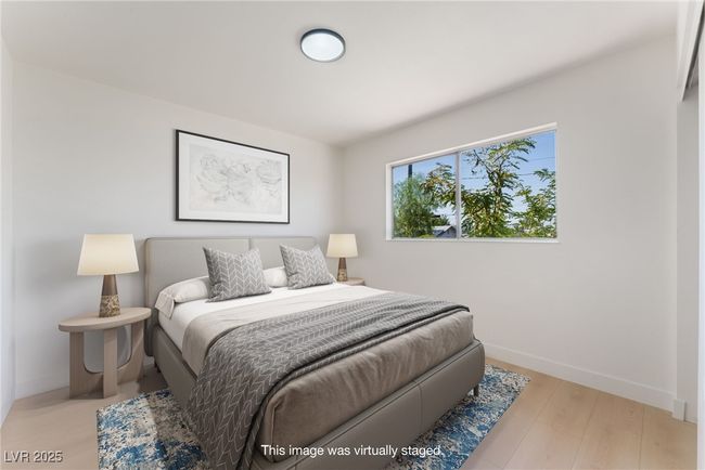 Bedroom featuring baseboards and wood finished floors | Image 40