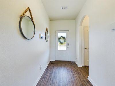 Doorway with dark wood-type flooring | Image 3