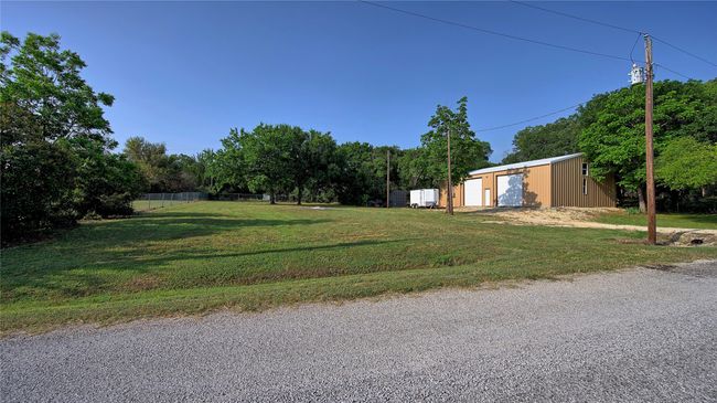 View of yard featuring a GARAGE. | Image 10