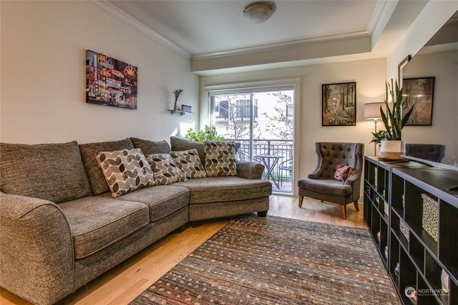 Large living room w/ slider access to dedicated balcony | Image 6