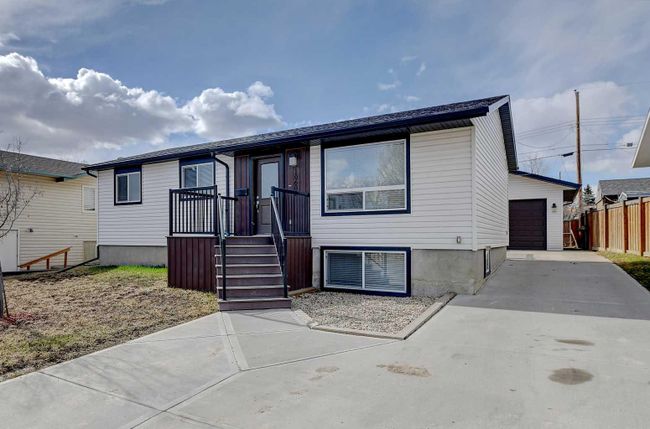 10602 92 B Street, Home with 5 bedrooms, 2 bathrooms and 5 parking in Grande Prairie AB | Image 1