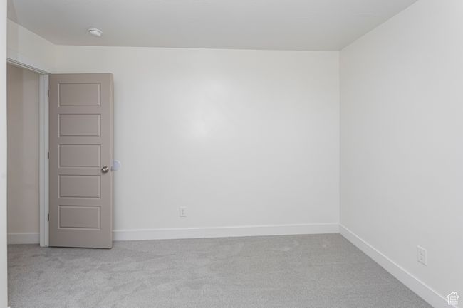 Unfurnished room with baseboards and light carpet | Image 33