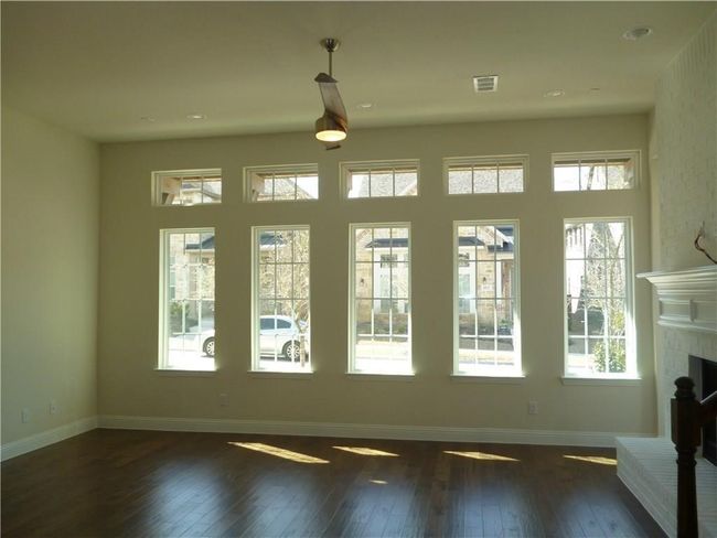 Entryway featuring wood-type flooring, a brick fireplace, baseboards, and recessed lighting | Image 4