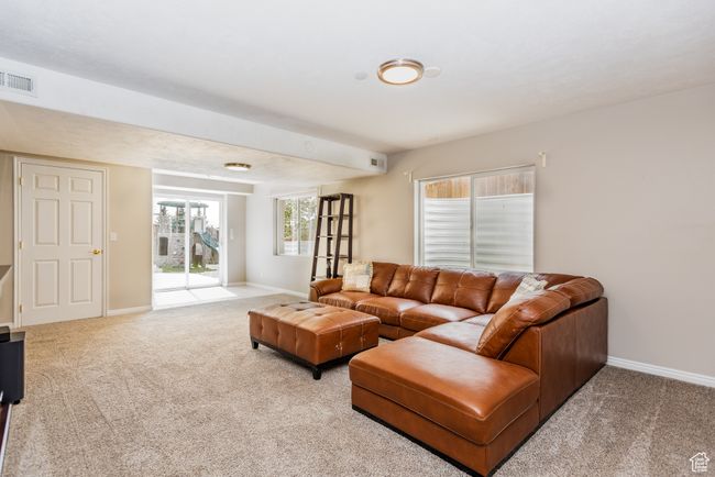 Living room featuring carpet floors and baseboards | Image 25