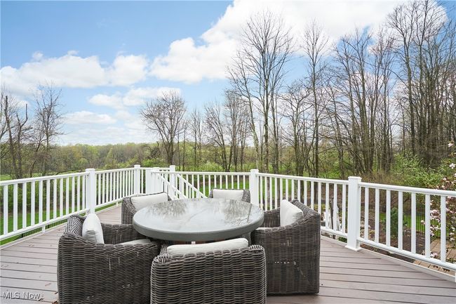 Trex deck featuring outdoor dining area is located off the dinette | Image 41