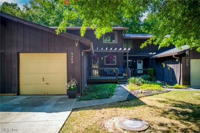 View of front of property with a garage and a front lawn | Image 1