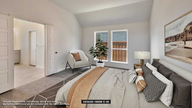 Carpeted bedroom featuring lofted ceiling and baseboards | Image 4
