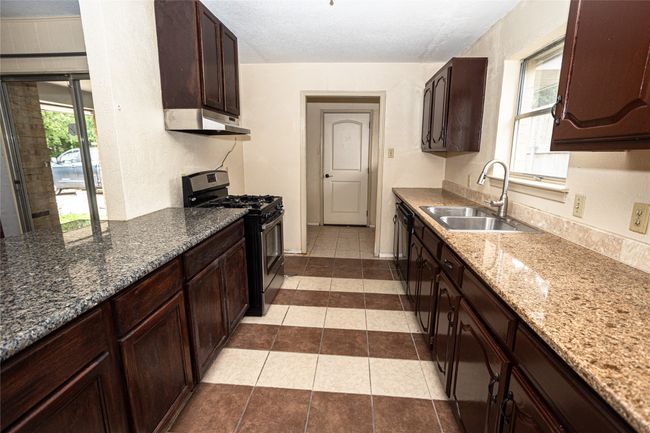 Kitchen view of the breakfast nook area | Image 8