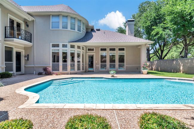 The covered patio outside the family room is the perfect spot to enjoy being outdoor, no matter what the weather! | Image 33