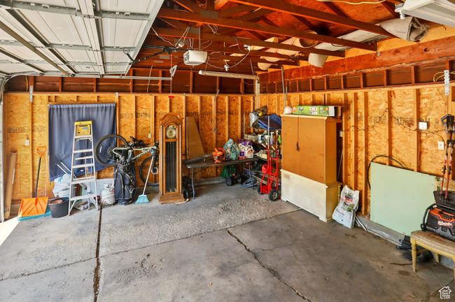 Garage featuring a garage door opener | Image 30