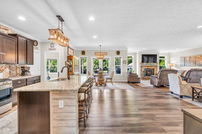 Chef's kitchen w/stainless steel appliances, pot filler, chimney vent and more | Image 15