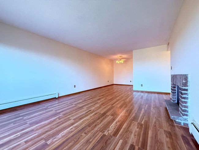 Living room has a dining L | Image 7