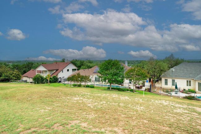 View of yard featuring a fenced in pool and fence | Image 39