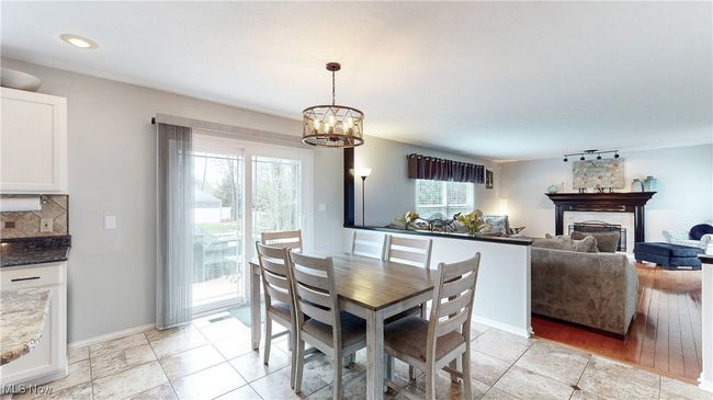 DINETTE AREA WITH SLIDING GLASS DOORS TO THE BACK DECK. | Image 13