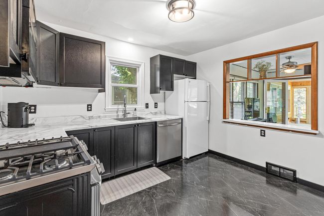 Kitchen opens into living area | Image 4