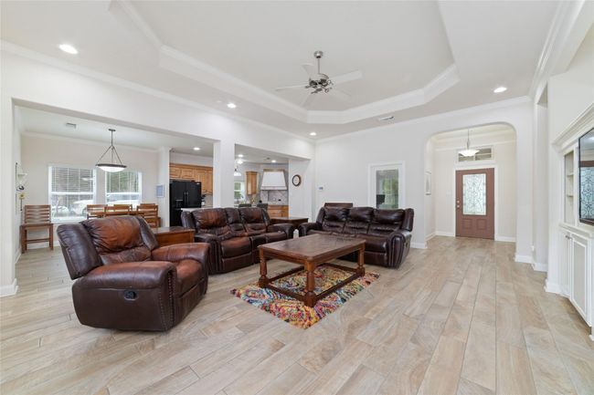 Nice-sized living room with built-ins. | Image 11