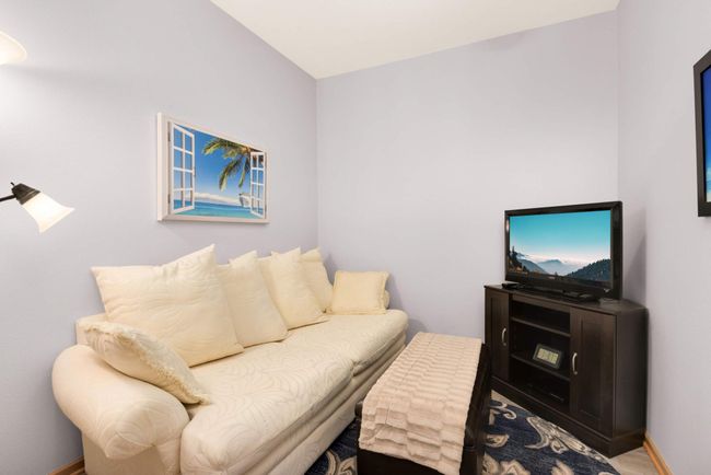 The den, set-up as a separate TV room. | Image 4