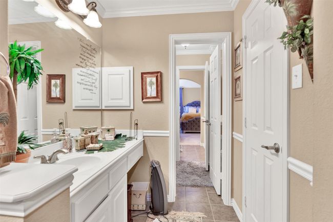 Sink and closet for bedroom 3; shower and commode are in the shared middle room. | Image 22