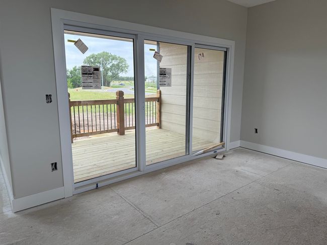 Doorway to outside featuring baseboards | Image 6