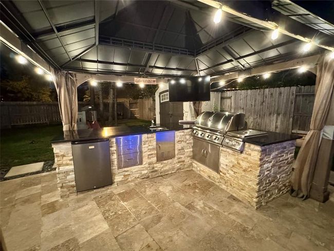 Outdoor kitchen at night with lights | Image 41
