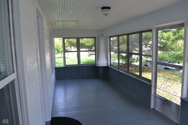 Sunroom is in the front of the house | Image 10