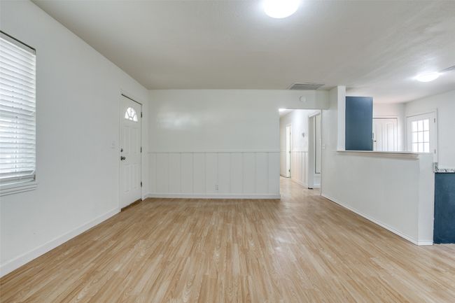 Empty room featuring light wood-style flooring and baseboards | Image 7