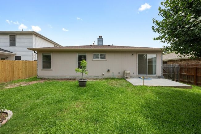 Rear view of property with a patio and a chimney | Image 26