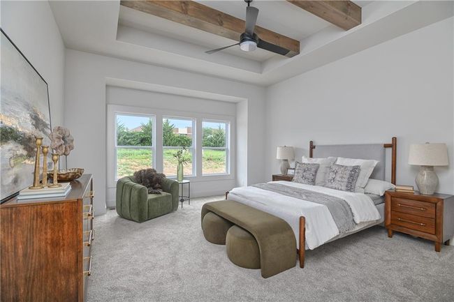 Bedroom with beamed ceiling, a raised ceiling, carpet, and ceiling fan | Image 21