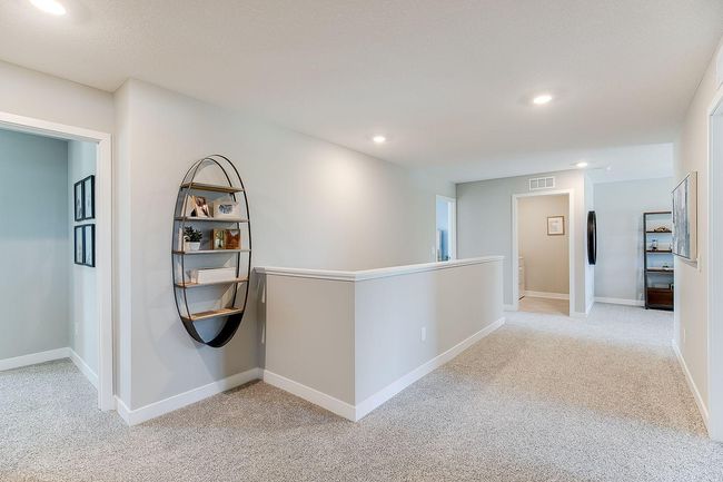 Relax, play and enjoy! This upper level loft room provides an additional gathering space. Photo of model home, color & options may vary. | Image 12