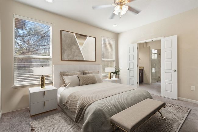 Virtually Staged: French doors guide you to the luxurious en-suite bathroom. | Image 10