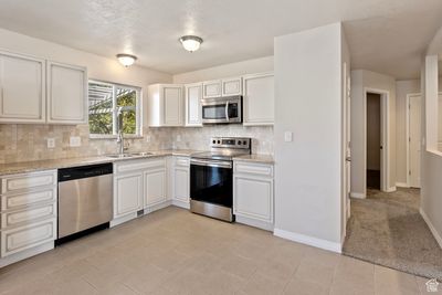 2048 W Celia Way, House other with 4 bedrooms, 2 bathrooms and 2 parking in Layton UT | Image 3