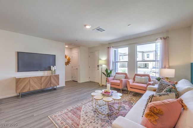 Living room featuring wood finished floors, visible vents, recessed lighting, and baseboards | Image 6
