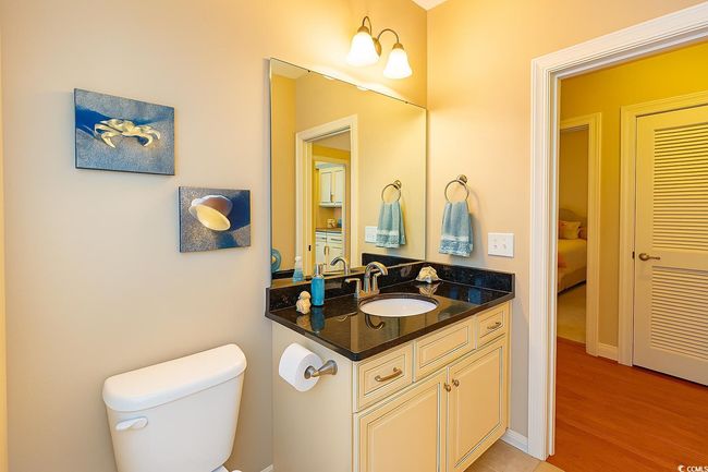 Bathroom featuring vanity, ensuite bathroom, and wood finished floors | Image 23