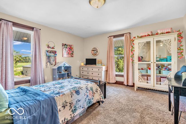 bedroom with carpet floors | Image 38