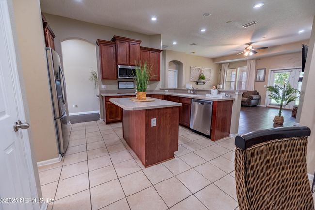 11760 Huckleberry Trl E, House other with 4 bedrooms, 2 bathrooms and null parking in MACCLENNY FL | Image 9
