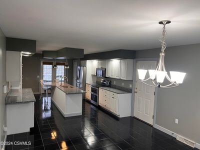 Dining area open to kitchen | Image 3