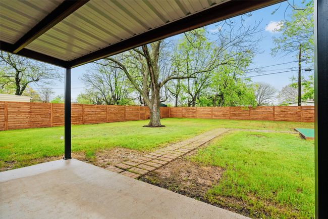 Fenced backyard featuring a patio area | Image 34
