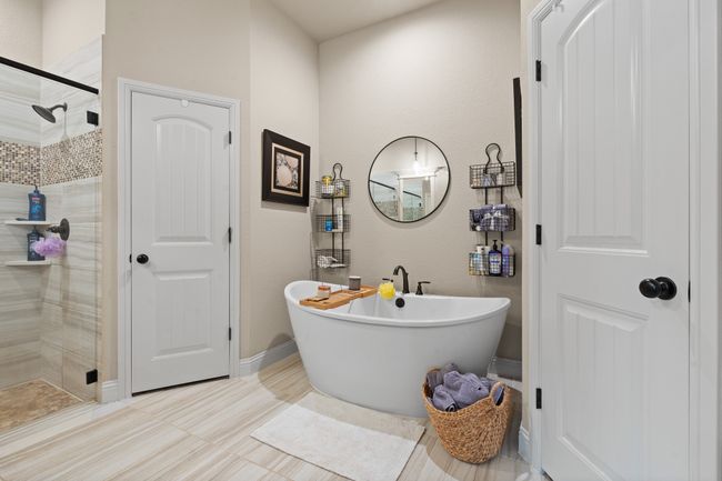 Full bathroom with a shower stall and a soaking tub | Image 17