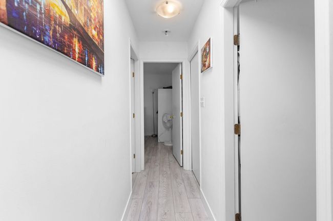 Hallway featuring light wood-style flooring and baseboards | Image 19