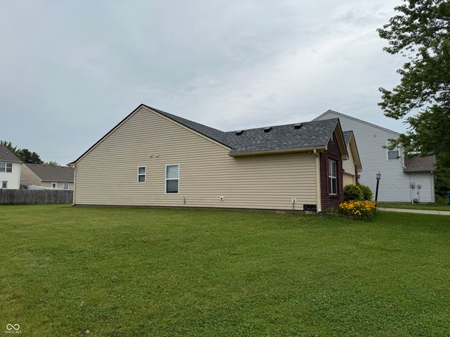 rear view of property with roof with shingles | Image 18