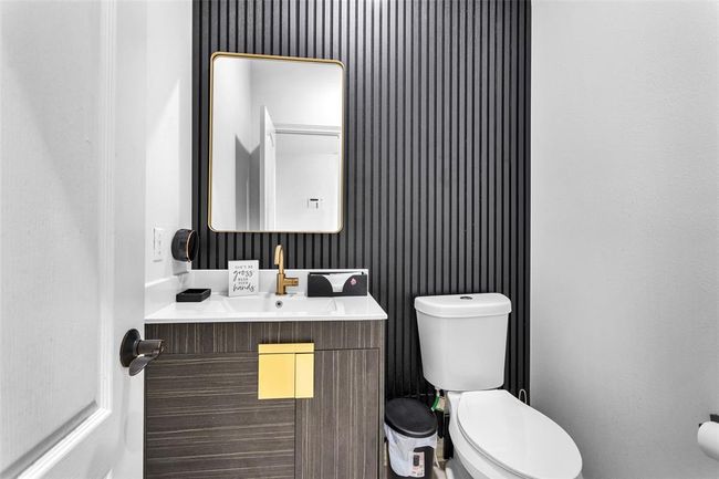 The updated half bathroom located downstairs. | Image 19