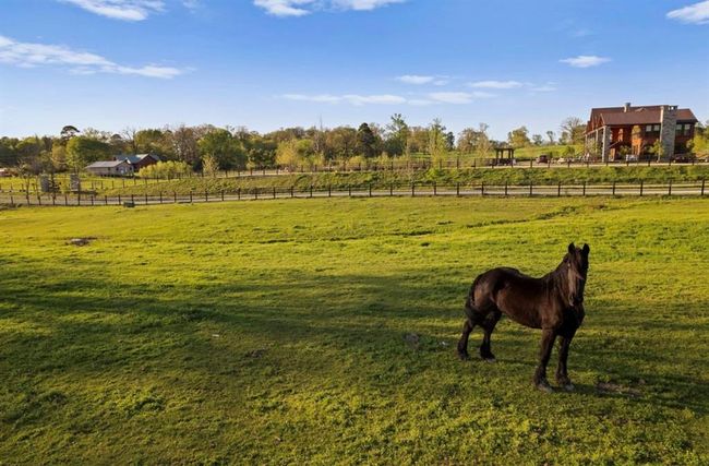 Surrounding community featuring fence, a lawn, and a rural view | Image 17