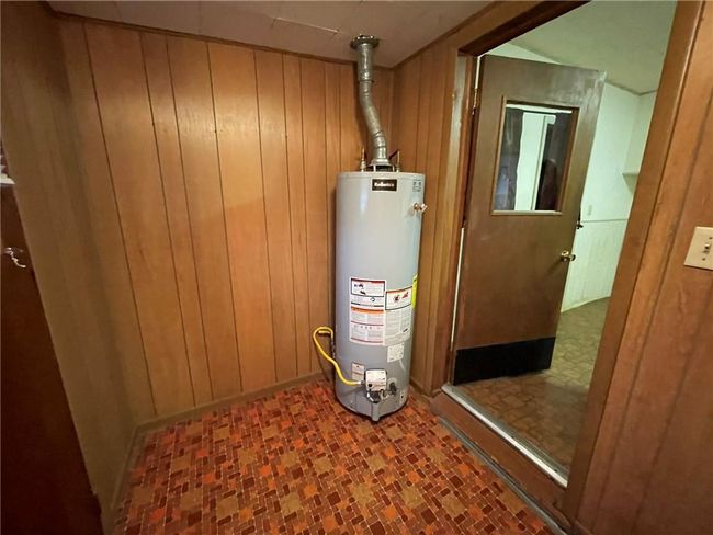 Utilities featuring gas water heater | Image 9