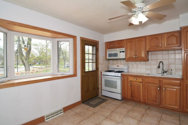 Kitchen with deck and backyard view | Image 9