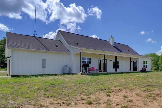 Rear view of property with a lawn | Image 35