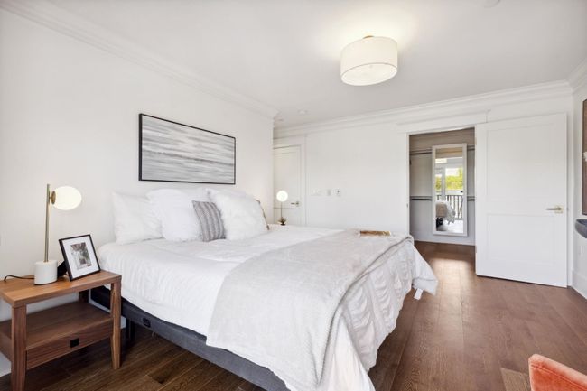 Bedroom featuring dark wood-style flooring and crown molding | Image 12