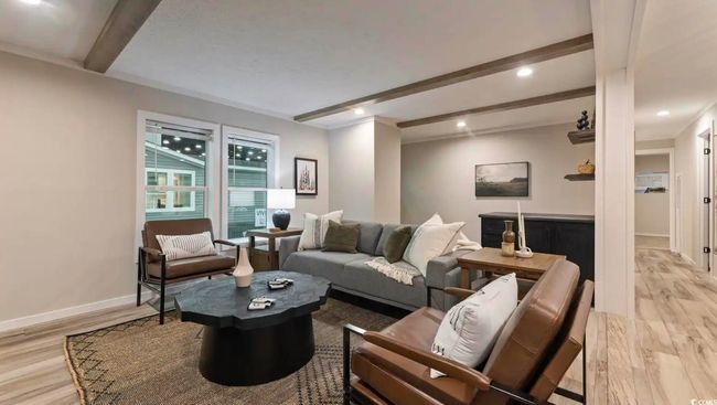 Living area with beam ceiling, light wood-style floors, baseboards, and recessed lighting | Image 6