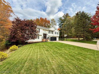 Split foyer home with a front yard and a garage | Image 3