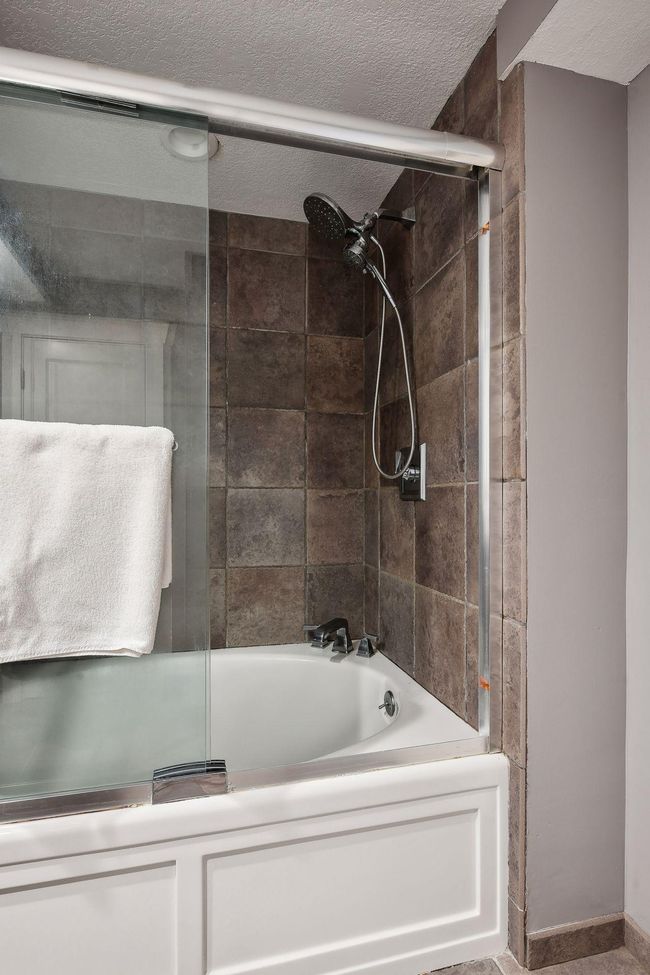 Deep tub in the lower level bath! Also there is a generous storage closet in the lower-level bath helps keep things organized! | Image 28